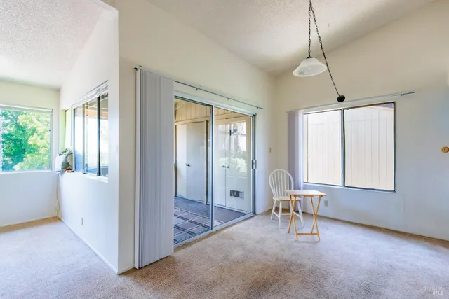 a view of a livingroom with furniture and windows