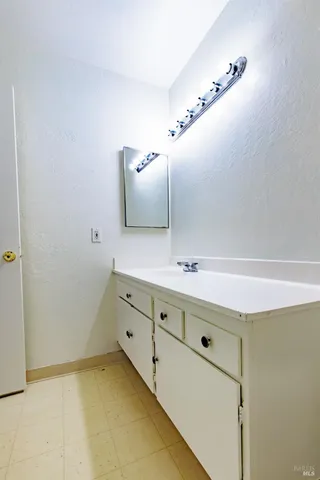 a bathroom with a bath tub with a shower