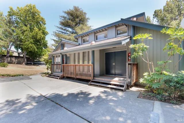 a dining room with furniture and chandelier