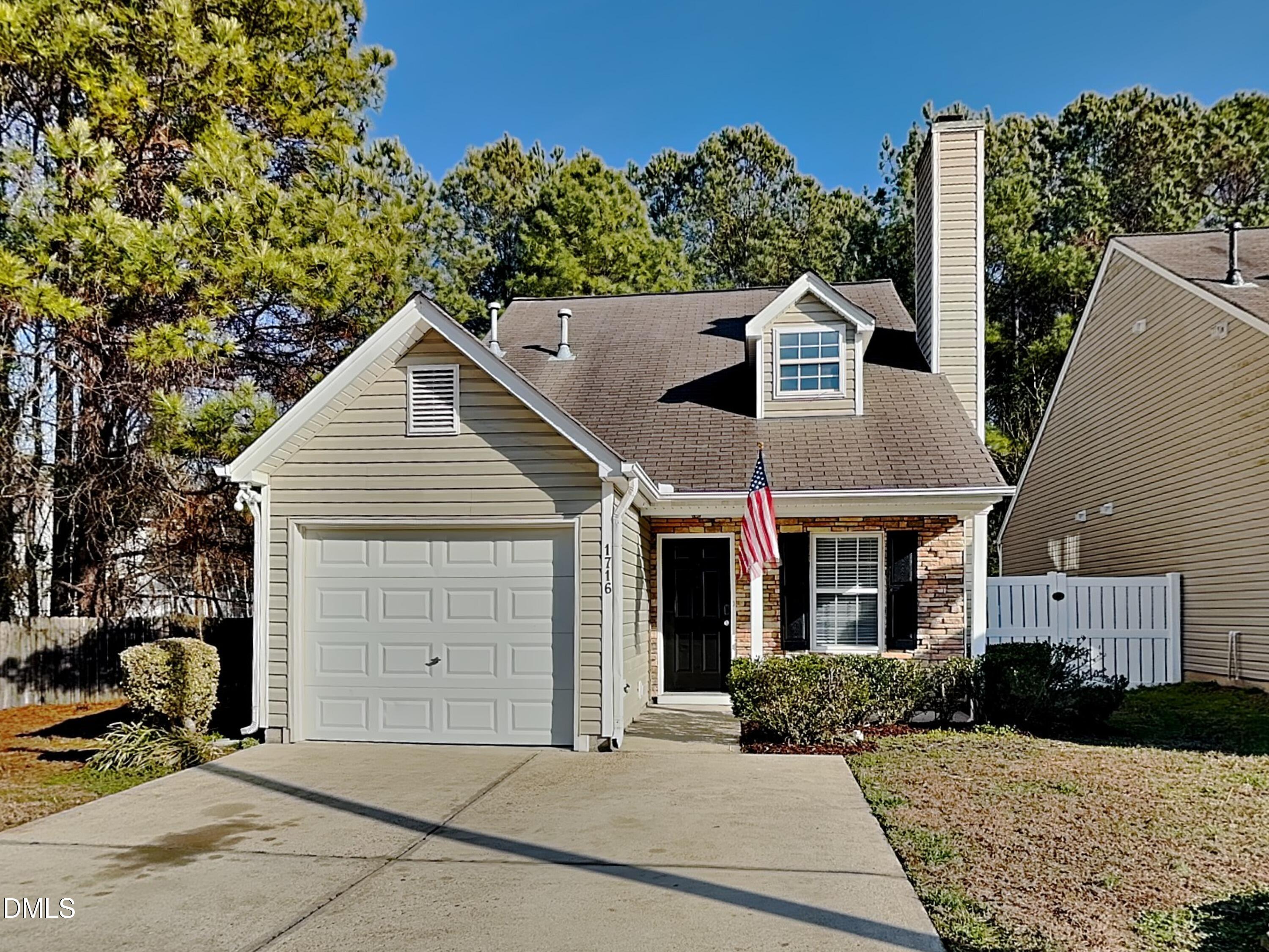 1716 Beacon Valley Drive Raleigh, NC 27604 - Photo 1 of 15 a front view of a house with entertaining space