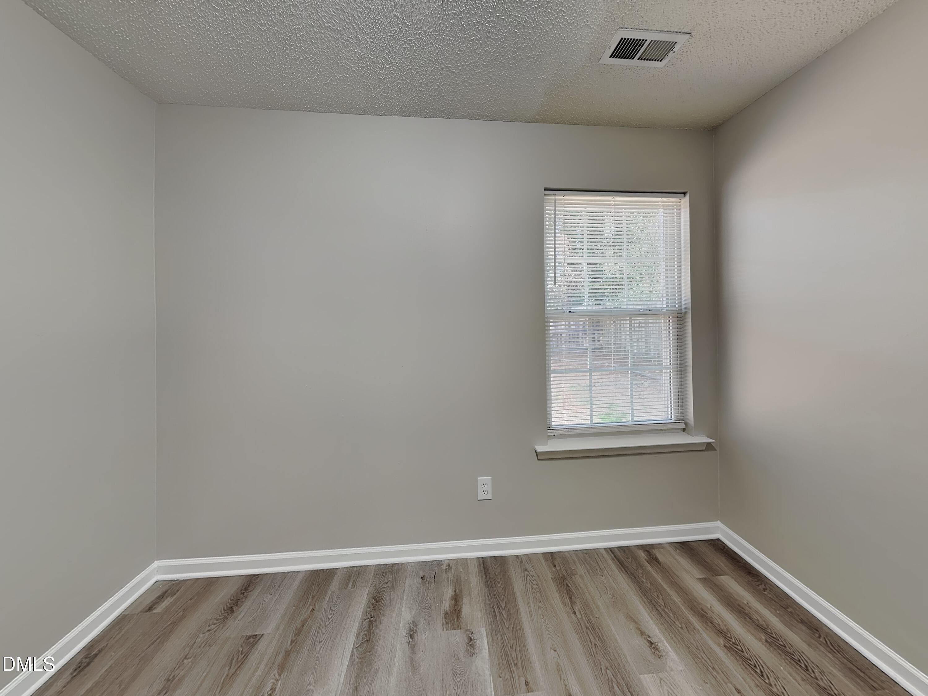1716 Beacon Valley Drive Raleigh, NC 27604 - Photo 12 of 15 an empty room with a window