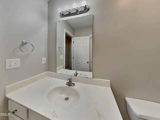 a bathroom with a sink and a toilet