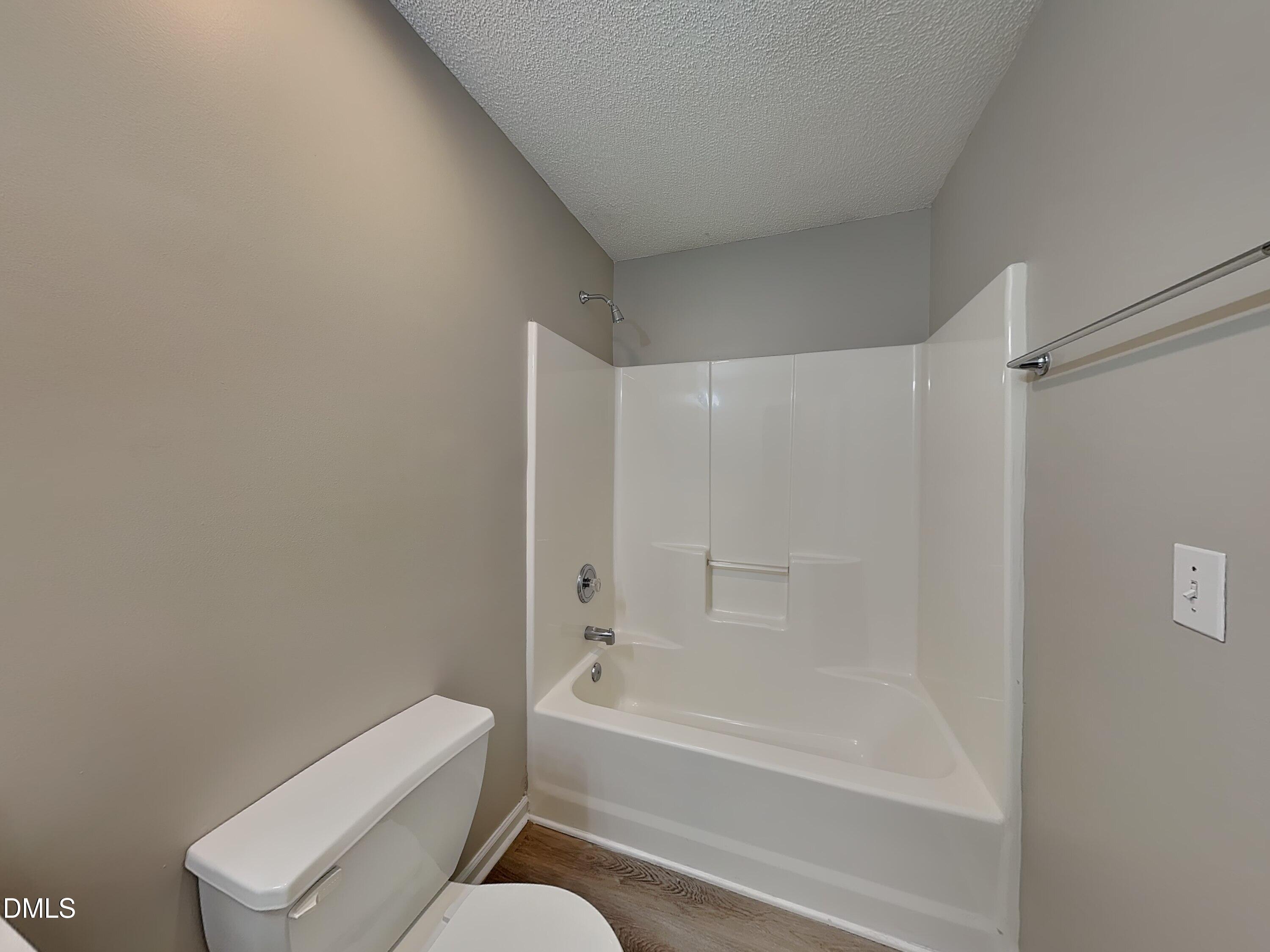 1716 Beacon Valley Drive Raleigh, NC 27604 - Photo 14 of 15 a bathroom with a bathtub and a toilet