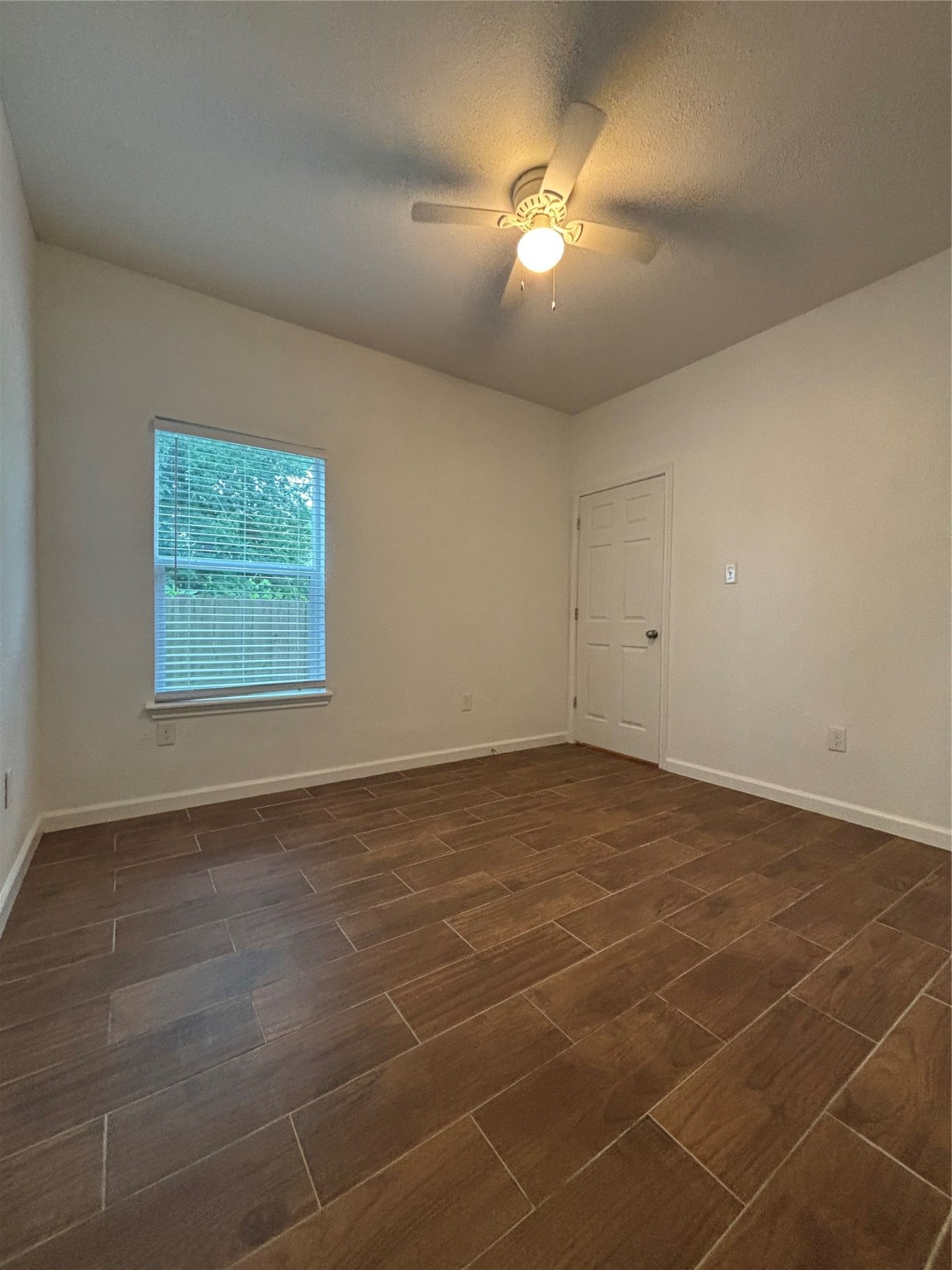 9834 Pelsey Street, Unit B Houston, TX 77029 - Photo 15 of 22 a view of an empty room with a window