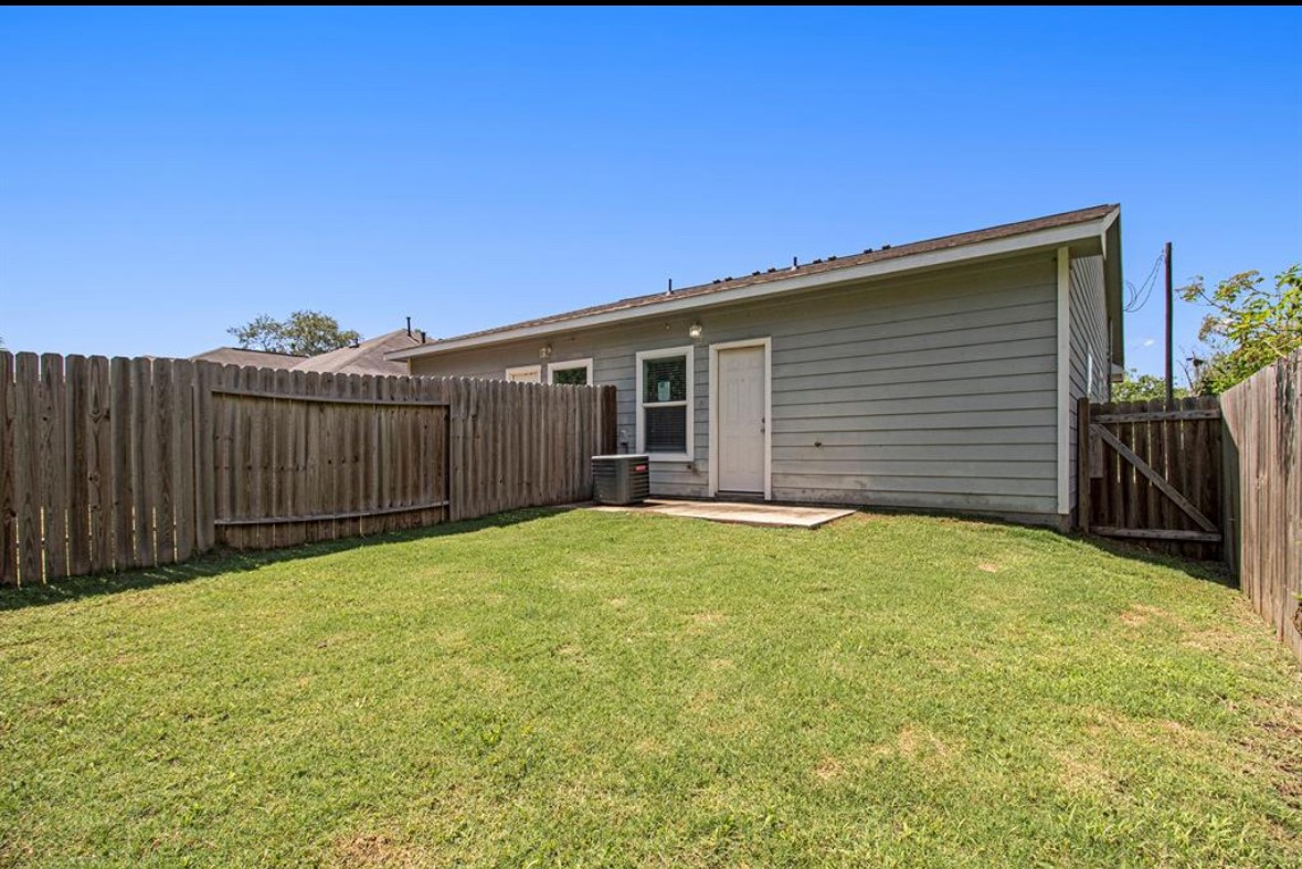 9834 Pelsey Street, Unit B Houston, TX 77029 - Photo 22 of 22 a view of backyard of house and wooden deck
