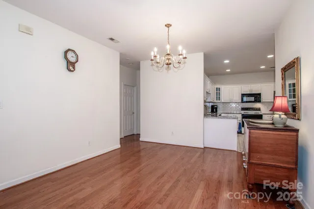 a bathroom with a granite countertop sink a mirror and a shower