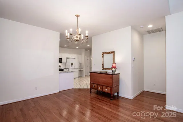 a bathroom with a granite countertop toilet and a sink