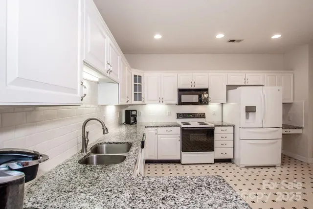 an empty room with walk in closet and empty racks