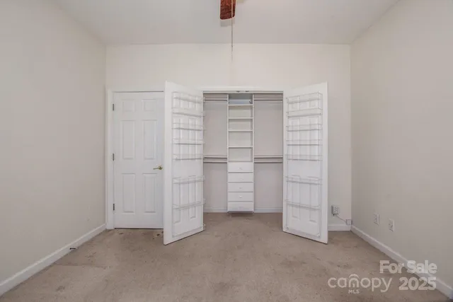 an aerial view of a house roof deck with chairs and a fire pit