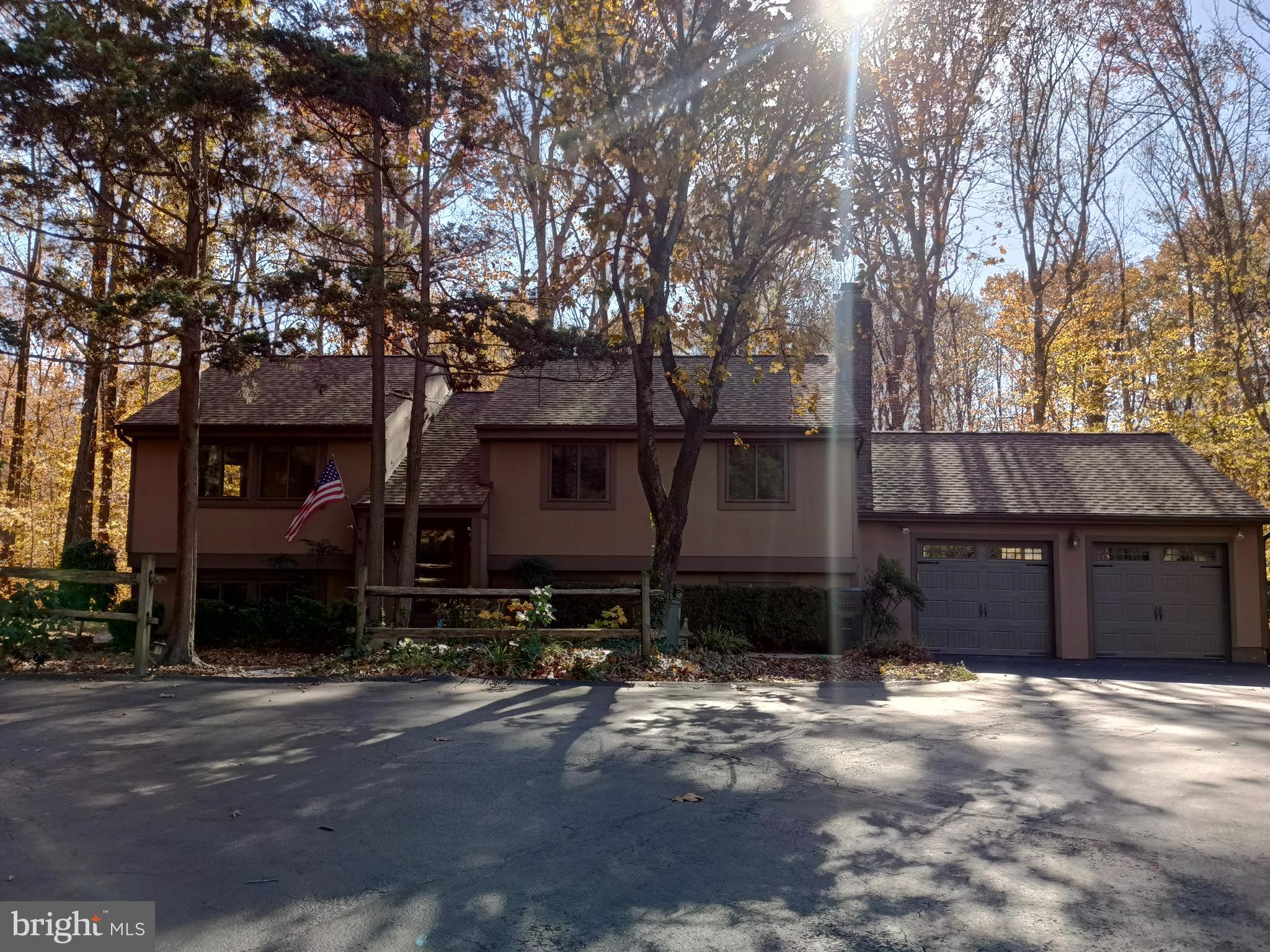 a view of a house with a yard covered in snow