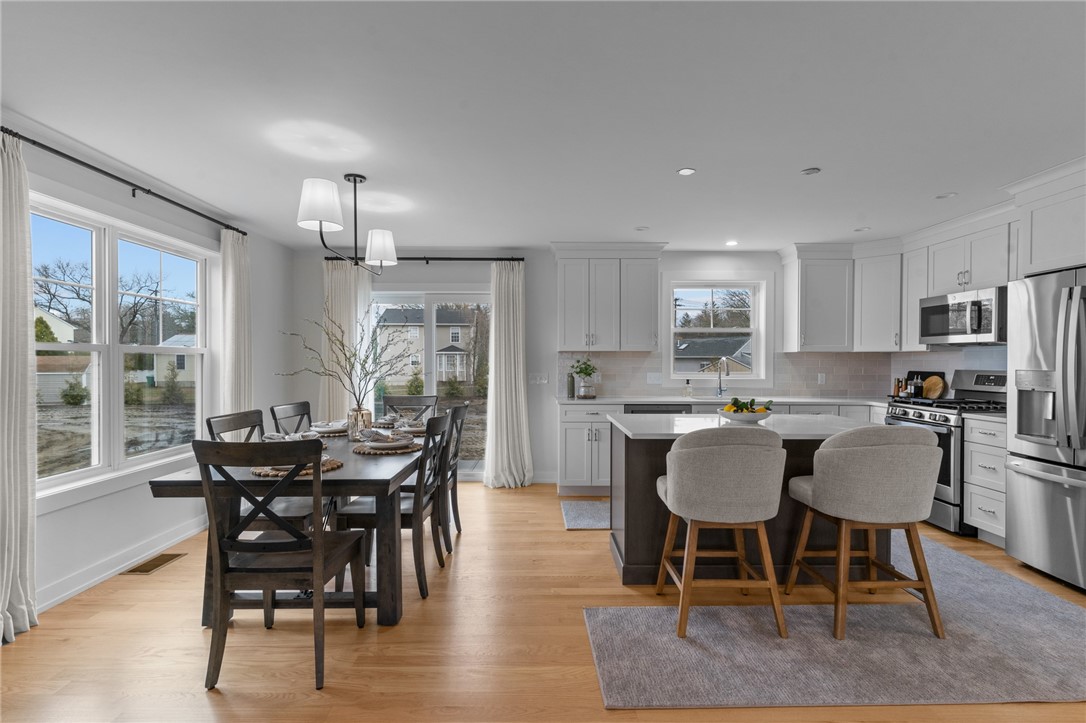 18 Red Maple Lane Warwick, RI 02886 - Photo 9 of 39 A closer look toward the dining area and kitchen, view from the living area