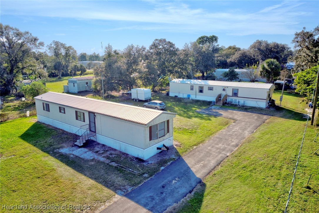 258-264 Griffin Road Wauchula, FL 33873 - Photo 1 of 33 an aerial view of a house with a yard