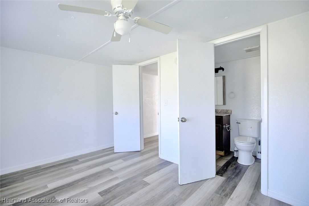 258-264 Griffin Road Wauchula, FL 33873 - Photo 13 of 33 wooden floor in an empty room