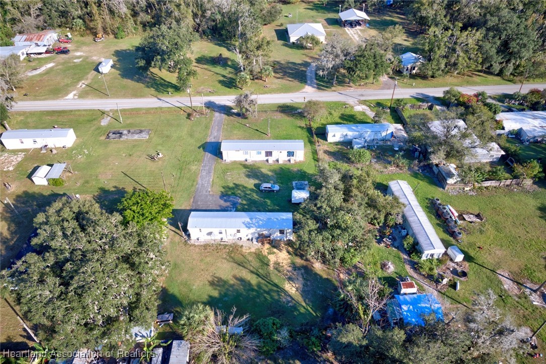 258-264 Griffin Road Wauchula, FL 33873 - Photo 32 of 33 an aerial view of residential houses with outdoor space