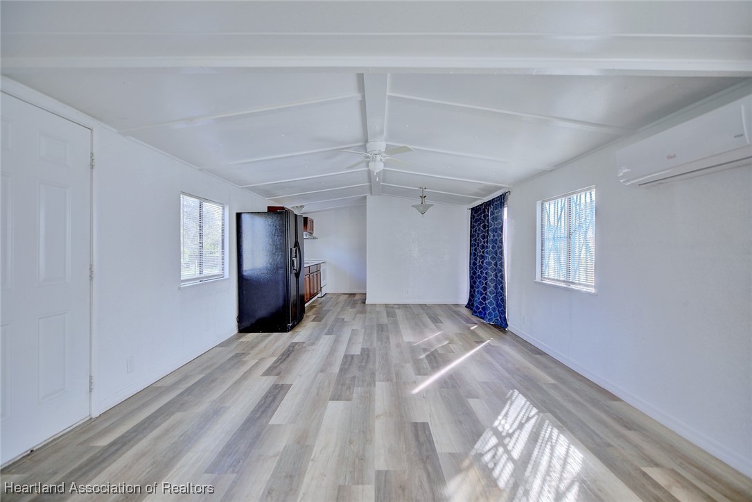 258-264 Griffin Road Wauchula, FL 33873 - Photo 5 of 33 a view of empty room with wooden floor