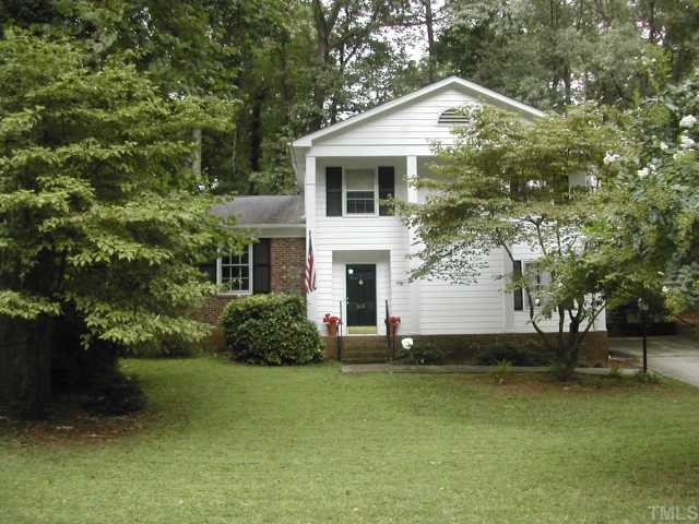 809 Davidson Street Raleigh, NC 27609 - Photo 1 of 12 a front view of a house with a yard and garage