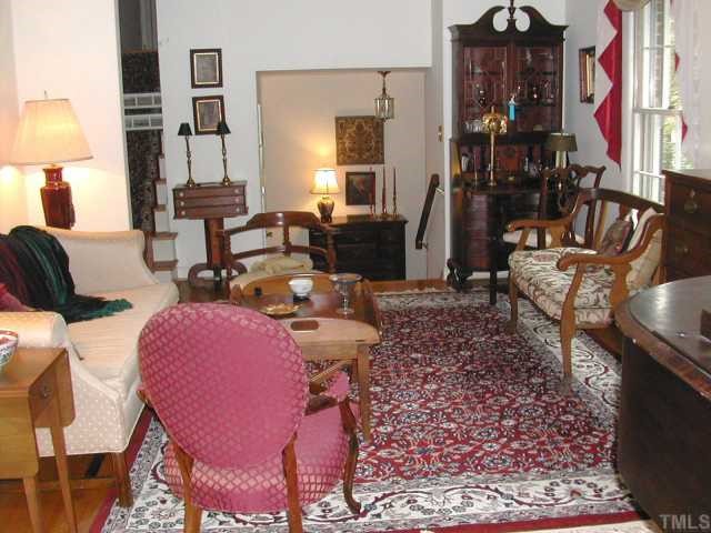 809 Davidson Street Raleigh, NC 27609 - Photo 2 of 12 a living room filled with furniture and a lamp