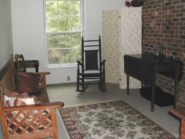 809 Davidson Street Raleigh, NC 27609 - Photo 10 of 12 a living room with furniture and a rug