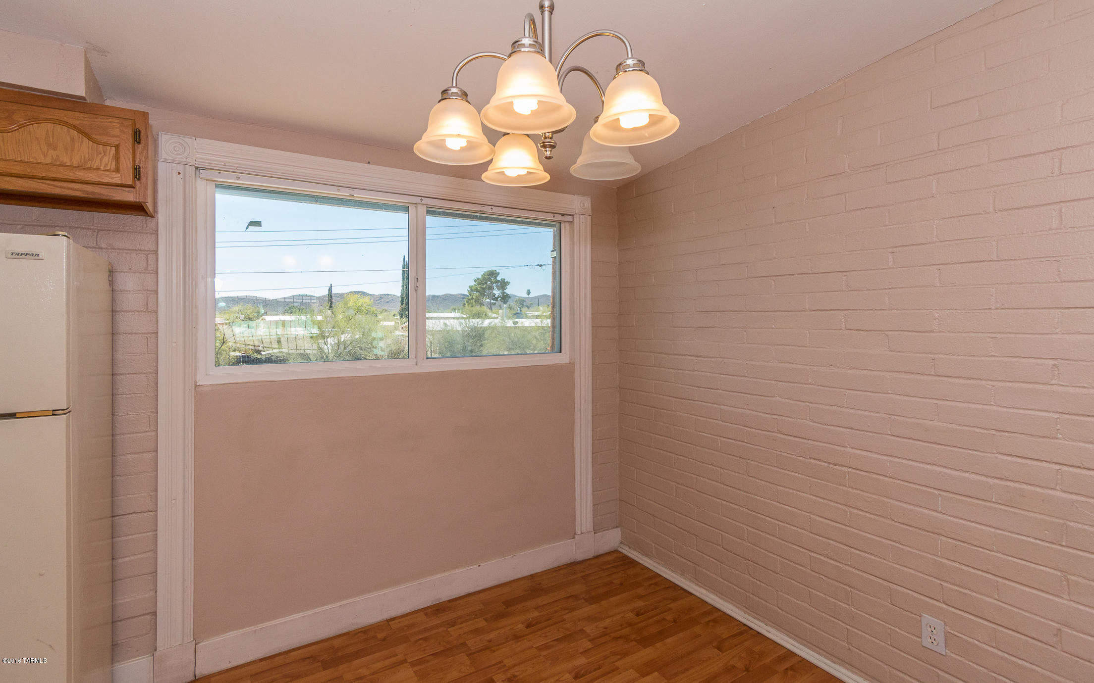 1807 West Merlin Road Tucson, AZ 85713 - Photo 13 of 34 a view of empty room with wooden floor and fan