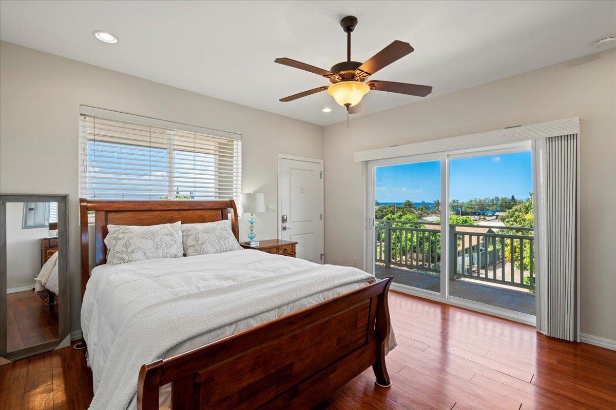 265 Kenolio Road Kihei, HI 96753 - Photo 11 of 50 a bedroom with a large bed and a large window