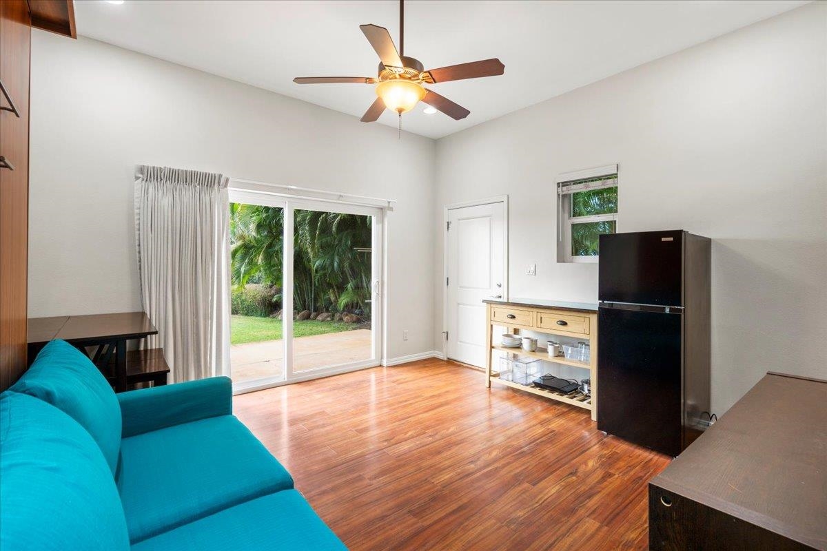 265 Kenolio Road Kihei, HI 96753 - Photo 18 of 50 a living room with furniture and a flat screen tv