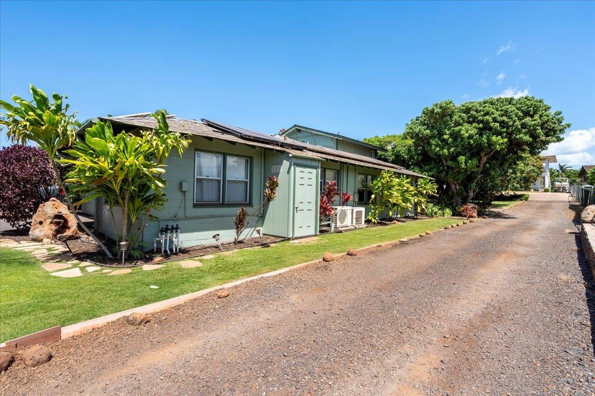 265 Kenolio Road Kihei, HI 96753 - Photo 23 of 50 a front view of house with yard and green space