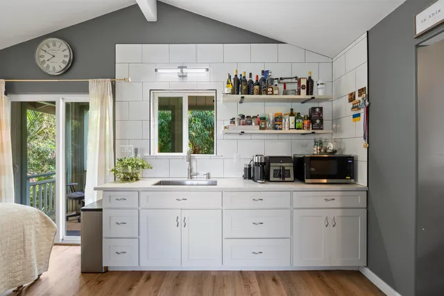 a bedroom with a bed and a bookshelf