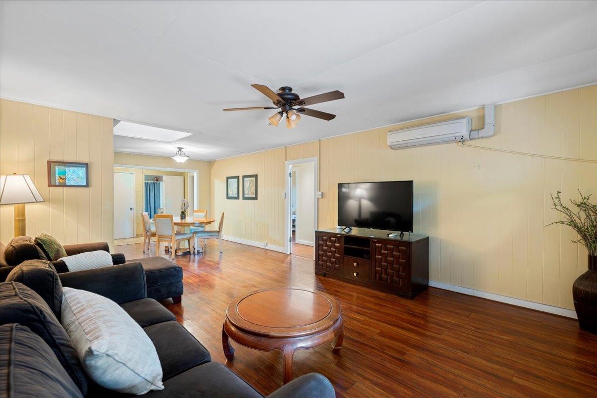 265 Kenolio Road Kihei, HI 96753 - Photo 38 of 50 a living room with furniture and a flat screen tv