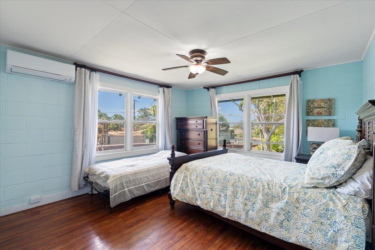 265 Kenolio Road Kihei, HI 96753 - Photo 41 of 50 a bedroom with a bed and a window