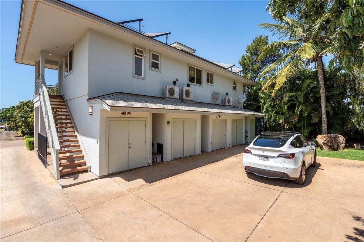 265 Kenolio Road Kihei, HI 96753 - Photo 6 of 50 a front view of a house with parking space