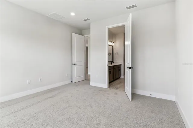 a bathroom with a double vanity sink mirror and shower