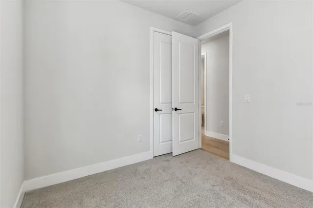 a bathroom with a sink toilet a mirror and shower