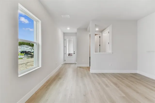 a view of an empty room with a window