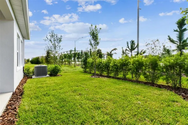 a view of a garden with a building in the background
