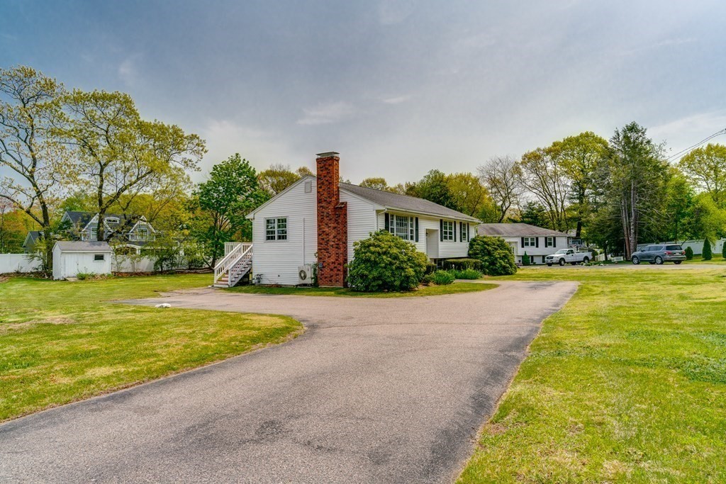 47 Kenney Street Canton, MA 02021 - Photo 2 of 8 a house with swimming pool in front of it