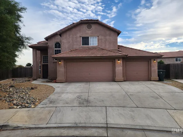 a front view of a house with a garage