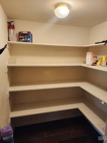 a view of storage and utility room with empty racks