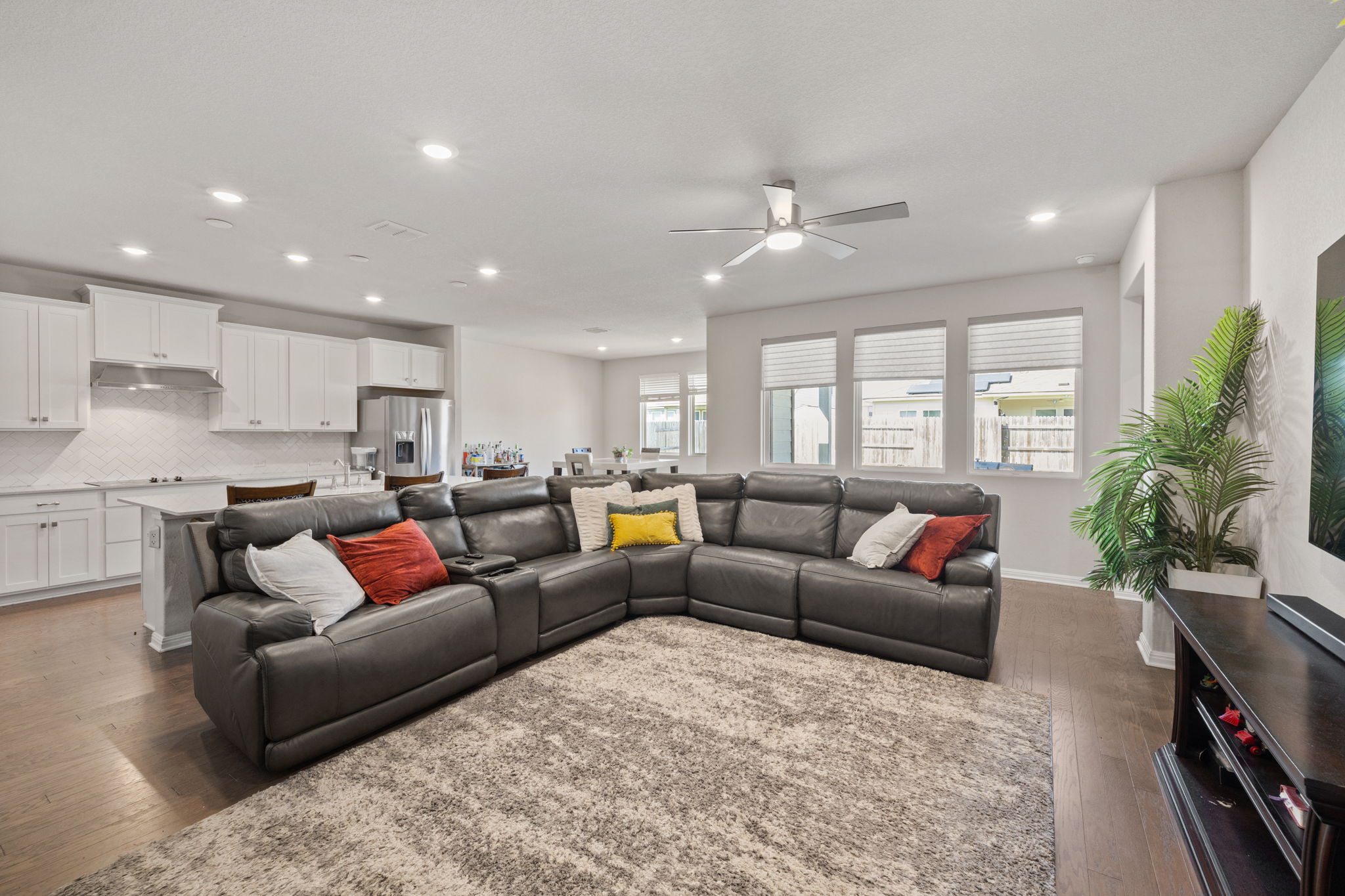 4009 Milano River Road Hutto, TX 78634 - Photo 13 of 39 Living room featuring ceiling fan, hardwood / wood-style flooring, and recessed lighting