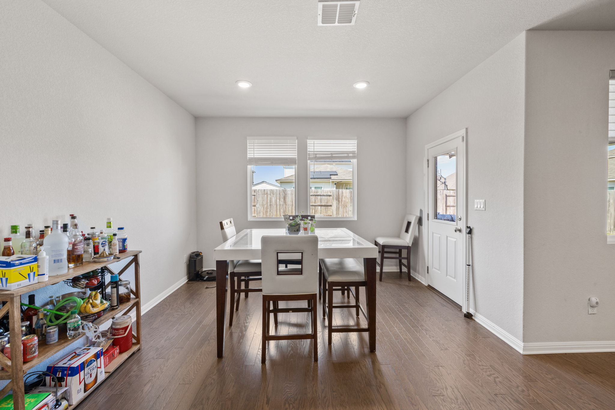 4009 Milano River Road Hutto, TX 78634 - Photo 15 of 39 Dining room with dark wood-type flooring