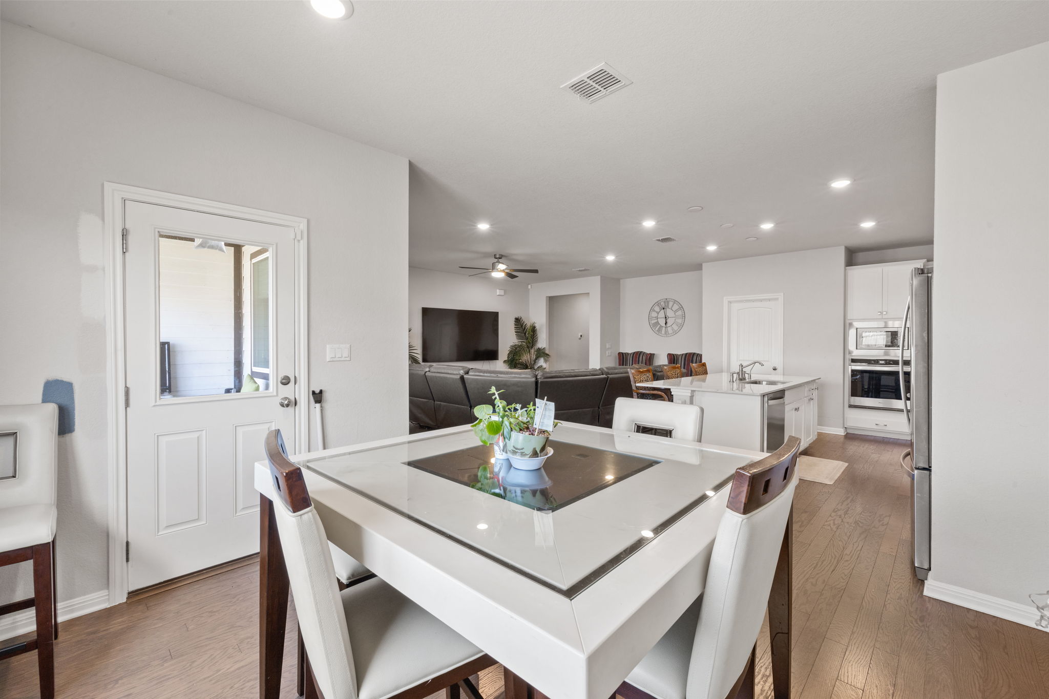 4009 Milano River Road Hutto, TX 78634 - Photo 16 of 39 Dining room featuring light wood-style flooring, recessed lighting, and a ceiling fan