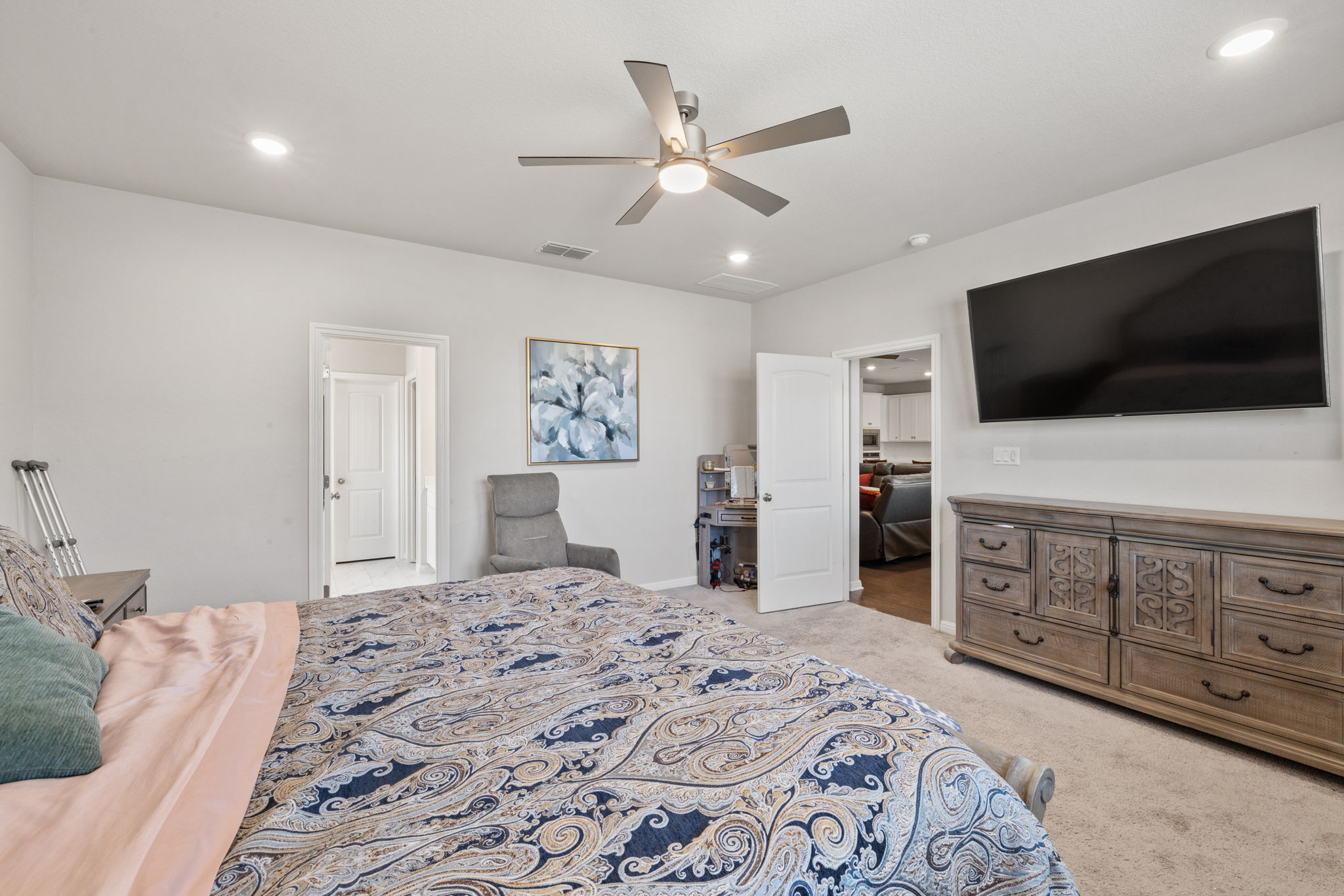 4009 Milano River Road Hutto, TX 78634 - Photo 19 of 39 Bedroom featuring light colored carpet, a ceiling fan, and recessed lighting