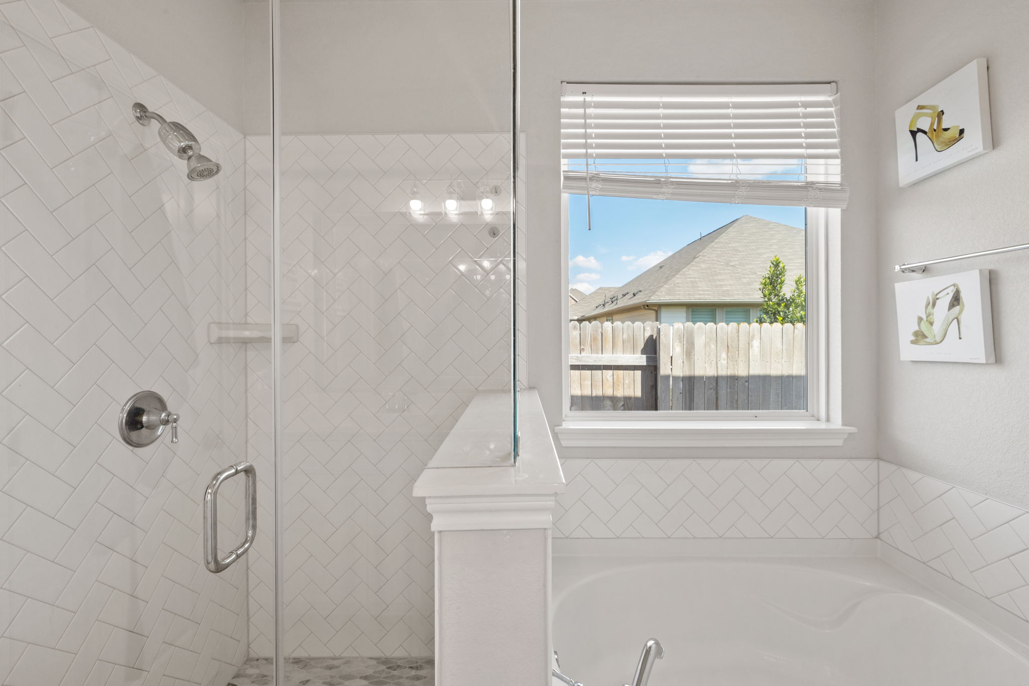 4009 Milano River Road Hutto, TX 78634 - Photo 20 of 39 Bathroom featuring a shower stall and a garden tub