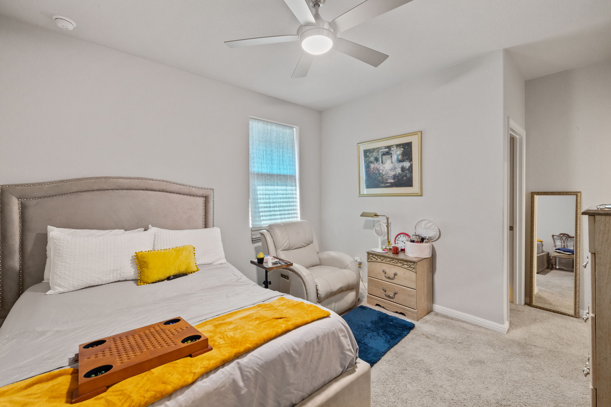 4009 Milano River Road Hutto, TX 78634 - Photo 31 of 39 Bedroom featuring light carpet and ceiling fan