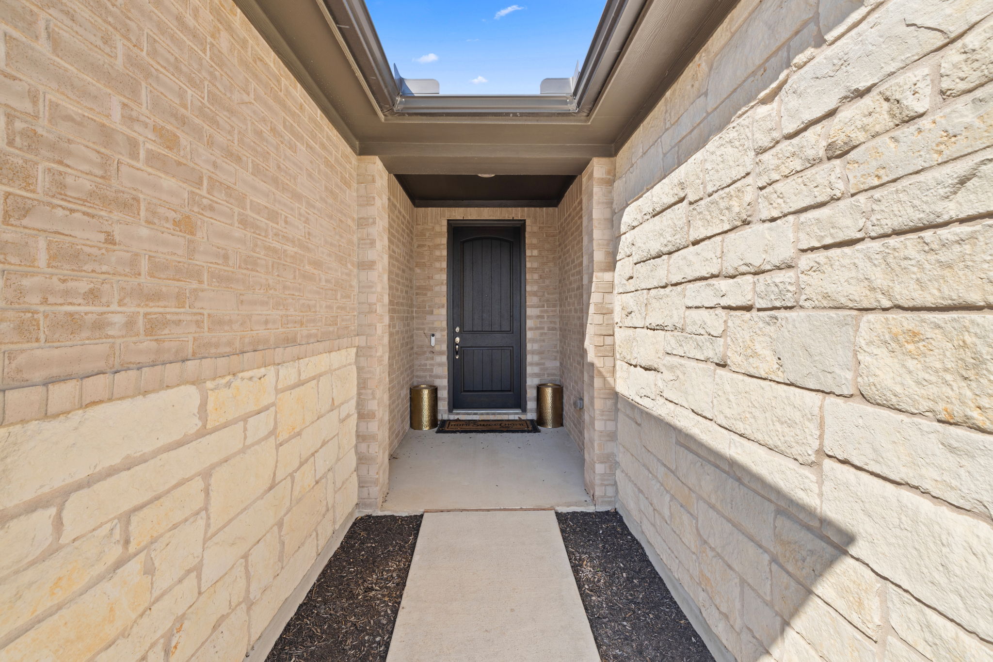 4009 Milano River Road Hutto, TX 78634 - Photo 5 of 39 Entrance to property featuring stone siding