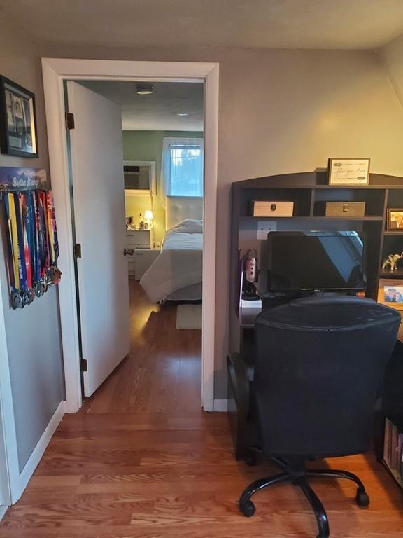121 Hardy Pond Road Waltham, MA 02451 - Photo 12 of 22 a view of a hallway with workspace and bedroom