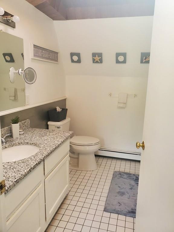 121 Hardy Pond Road Waltham, MA 02451 - Photo 9 of 22 a bathroom with a granite countertop sink a toilet and a mirror