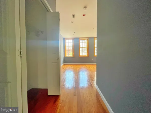 view of room with wooden floor and windows