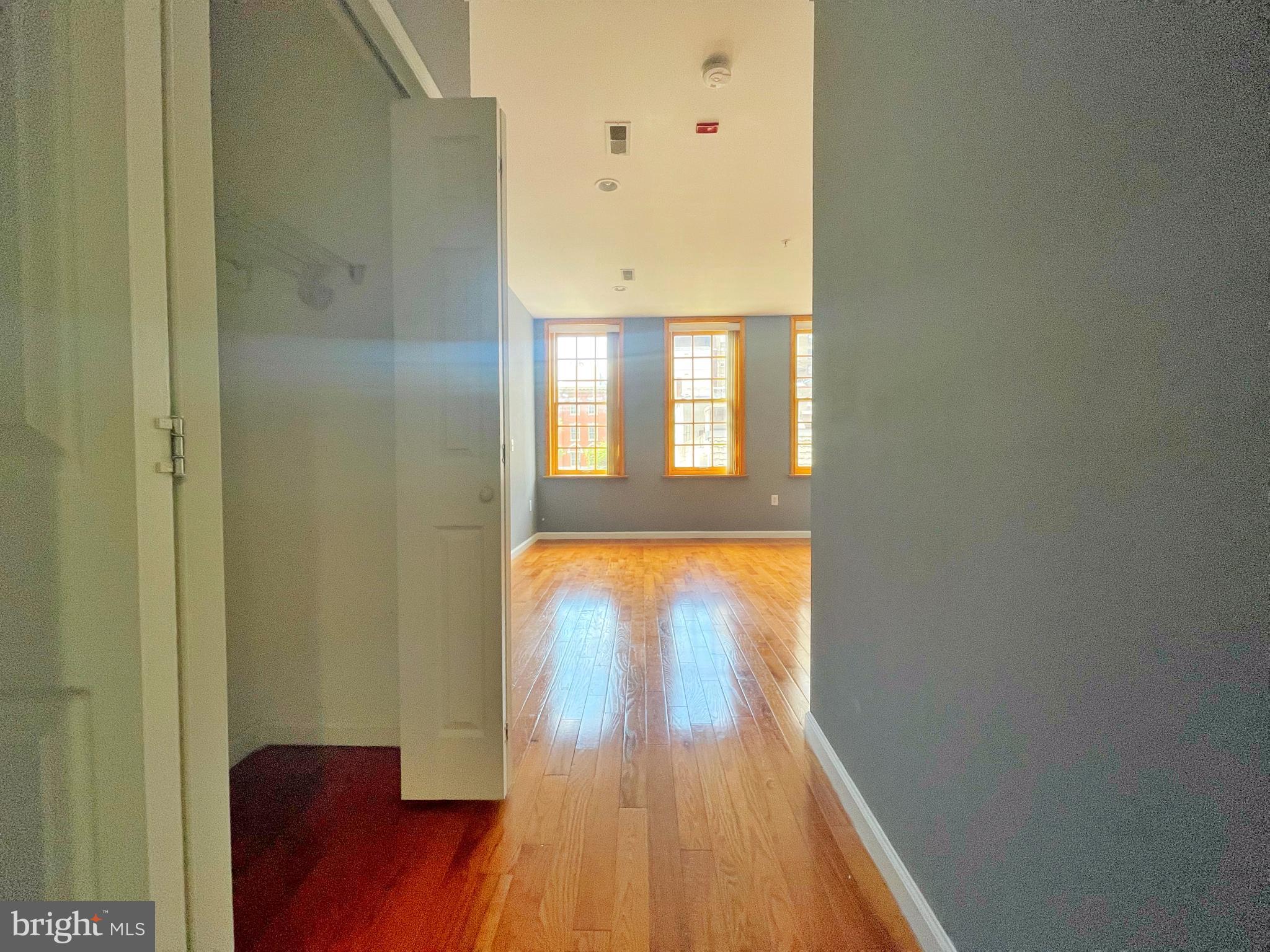 1316 Walnut Street, Unit 3R Philadelphia, PA 19107 - Photo 8 of 15 view of room with wooden floor and windows