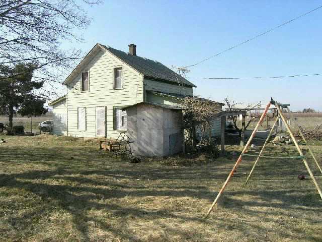 a view of a house with a wooden deck