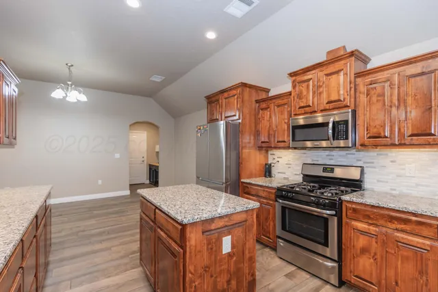 a bedroom with a bed and a desk